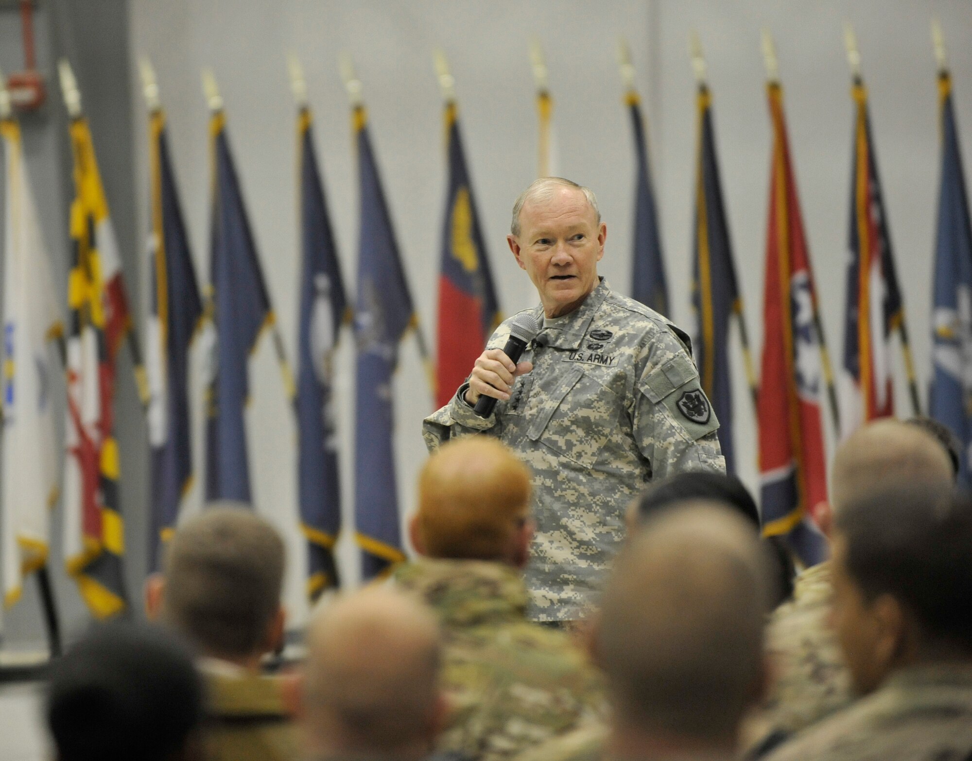 U.S. Army Gen. Martin E. Dempsey, chairman of the Joint Chiefs of Staff, talks to Service members at a town hall meeting at Bagram Airfield, Afghanistan, Feb. 26, 2014. Dempsey answered questions ranging from the future of U.S. military operations in Afghanistan to force reduction measures.(U.S. Air Force photo by Senior Master Sgt. Gary J. Rihn/Released)(photo was cropped to emphasize subject)