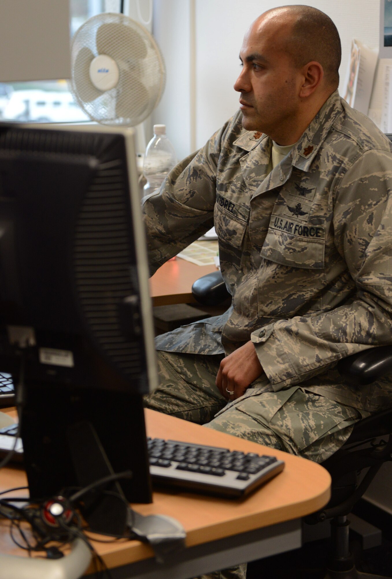 RAMSTEIN AIR BASE, Germany -- Maj. Rene Alvidrez, U.S. Air Forces in Europe-Air Forces Africa Business Transformation Office Information Management and Technology Branch chief, takes a look at Airmen's List Feb. 25, 2014 while working in his office here. Alvidrez designed the site to help USAFE-AFAFRICA units save resources and money. The site has saved the command $150,000 since June 2013.  (U.S. Air Force Photo By Tech. Sgt. James M. Hodgman)  