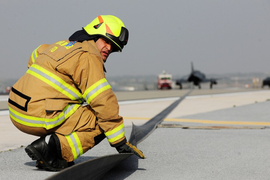 Hakan Erdal, 39th Civil Engineer Squadron firefighter, inspects the cables after a BAK-12 aircraft arresting barrier system test Feb. 24, 2014, Incirlik Air Base, Turkey. Aircraft arresting systems are used for landing aircraft on short runways, emergencies involving brake failure, steering problems or other situations where aircraft cannot use the full length of the runway. (U.S. Air Force photo by Senior Airman Nicole Sikorski/Released) 