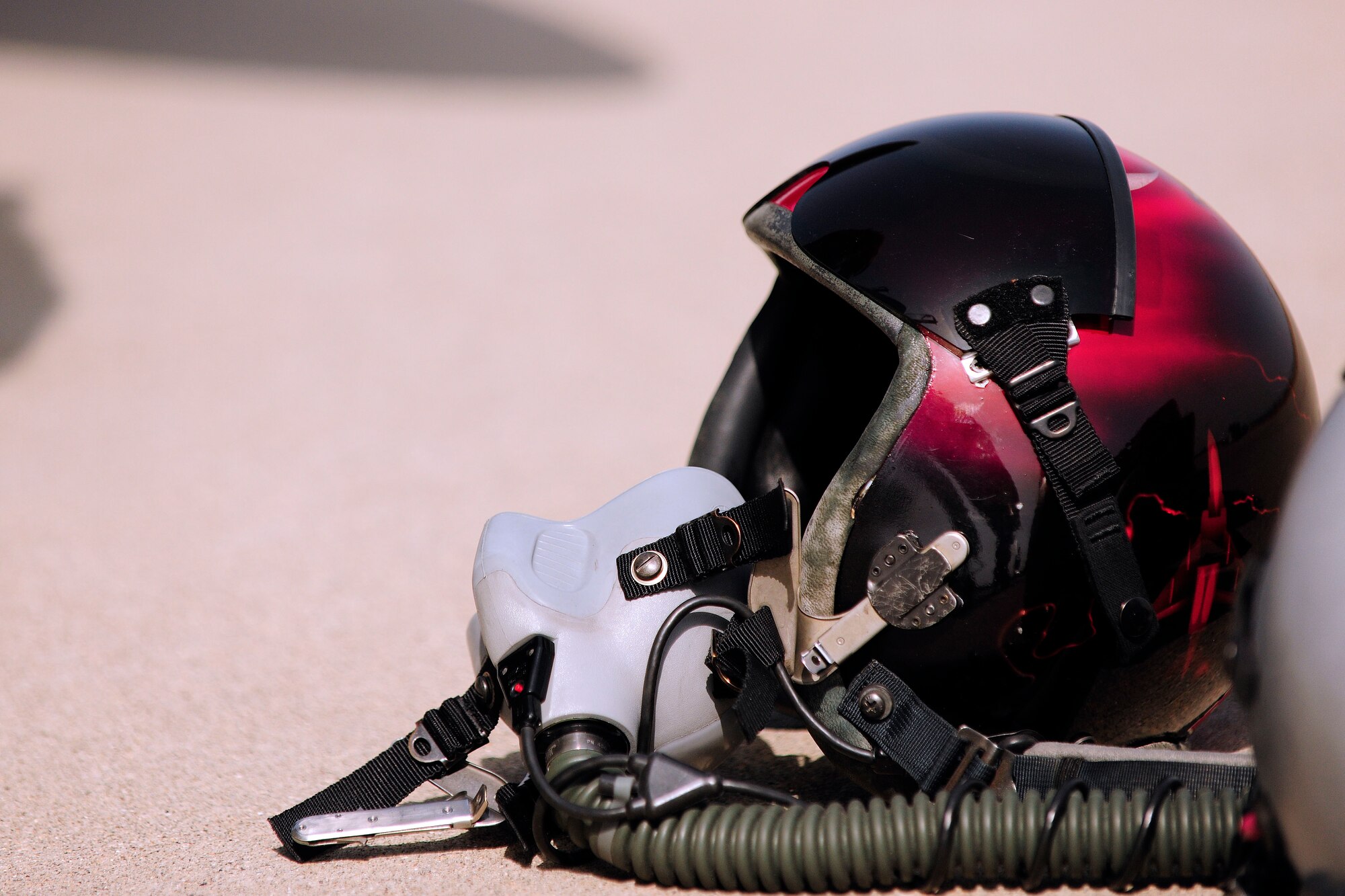 A Turkish pilot’s helmet rests on the ground before being used for the BAK-12 aircraft arresting barrier system test Feb. 24, 2014, Incirlik Air Base, Turkey. Annual tests such as this are an example of Turkish and U.S. Air Force partnership that ensures mission readiness at Incirlik AB. (U.S. Air Force photo by Senior Airman Nicole Sikorski/Released) 