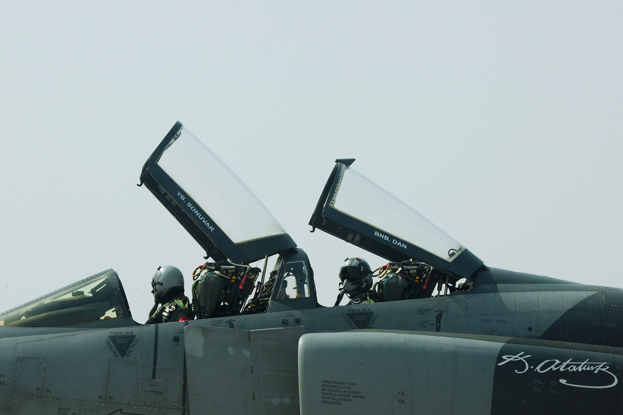 Turkish air force pilots taxi down the runway in an F-4 Phantom, before testing the BAK-12 aircraft arresting barrier system Feb. 24, 2014, Incirlik Air Base, Turkey.  The BAK-12 system is a permanent arresting system installed in sheds alongside the runway and is used to bring aircraft to a safe stop when the aircraft is unable to stop on its own. (U.S. Air Force photo by Senior Airman Nicole Sikorski/Released) 
