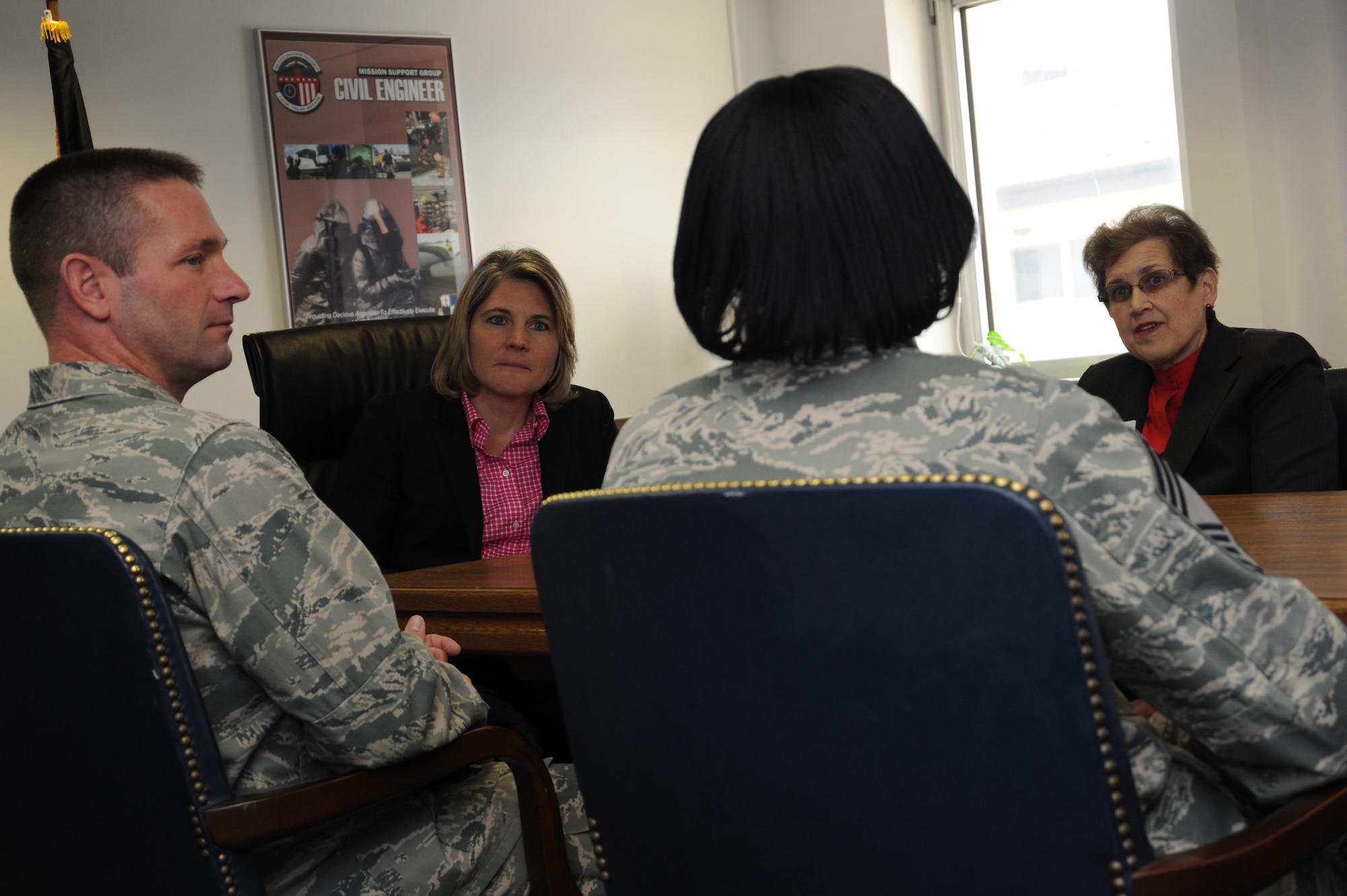 Sherri Brown, senior vice president of the American Red Cross' Service to the Armed Forces, back left, and Ahava Martin, western regional manager of the American Red Cross' Service to the Armed Forces, back right, visit with 52nd Mission Support Group leadership Feb. 25, 2014, at Spangdahlem Air Base, Germany. Brown visited with 52nd Fighter Wing leadership to discuss what her organization does on Spangdahlem and how they can improve their partnership with the military. (U.S. Air Force photo by Airman 1st Class Dylan Nuckolls/Released)