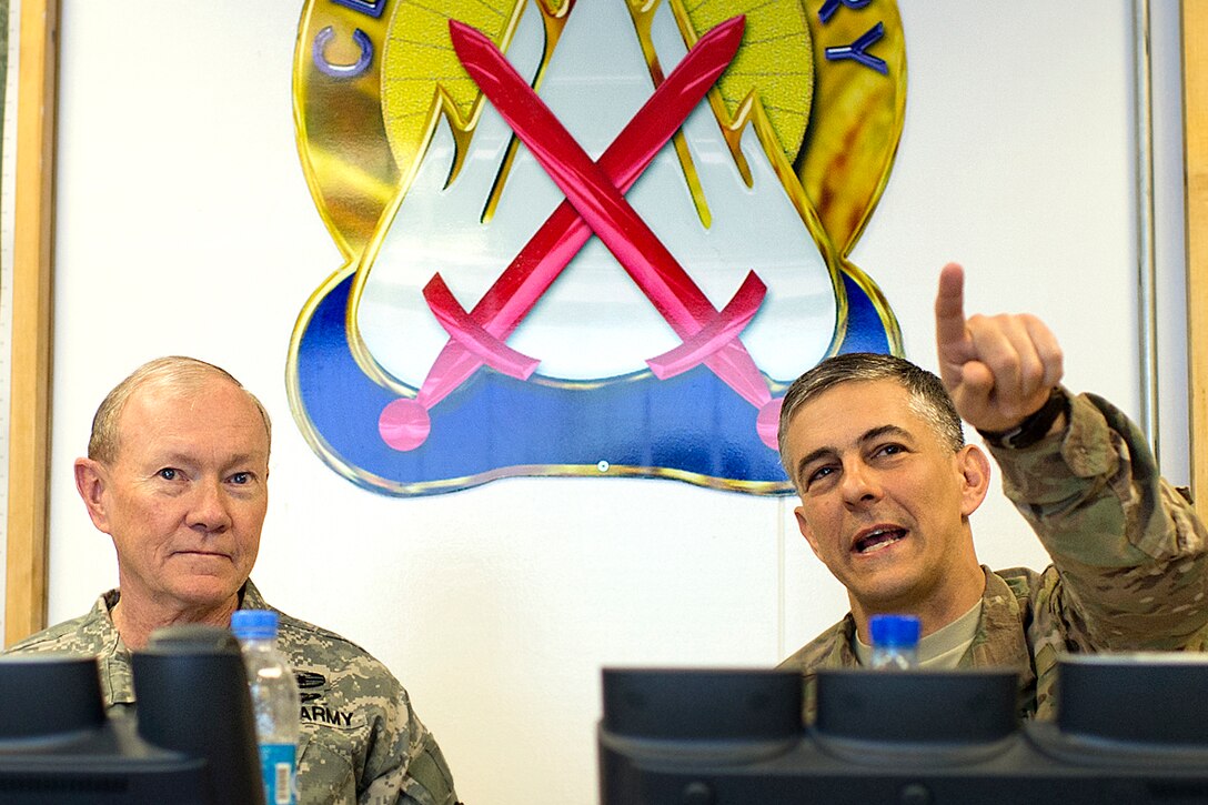 U.S. Army Maj. Gen. Stephen J. Townsend, right, commander of the Combined Joint Task Force 10 and 10th Mountain Division, briefs U.S. Army Gen. Martin E. Dempsey, chairman of the Joint Chiefs of Staff, about local operations at Regional East headquarters on Bagram Airfield, Afghanistan, Feb. 26, 2014.