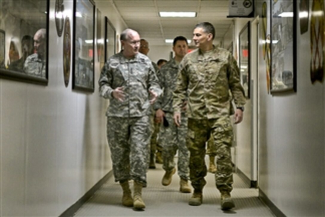 U.S. Army Maj. Gen. Stephen J. Townsend, right, commander of the Combined Joint Task Force 10 and 10th Mountain Division, walks with U.S. Army Gen. Martin E. Dempsey, chairman of the Joint Chiefs of Staff, at Regional East headquarters on Bagram Airfield, Afghanistan, Feb. 26, 2014. Dempsey is in Afghanistan to visit troops and commanders. 