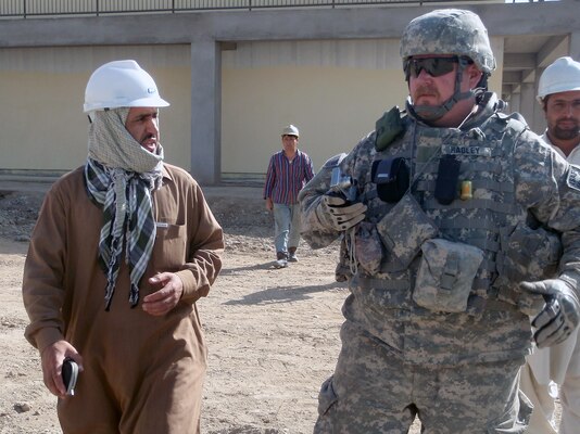 Working with Afghan engineers and technicians builds local capacity, an important part of Chuck Hadley’s duties. The U.S. Army Corps of Engineers operates an Afghan Quality Assurance Representative program and sharing expertise and coaching leaves a legacy of better trained professionals and good relations, which is just as important as the structures Hadley helps them build for their country. (U.S. Army Corps of Engineers photo by Lt. Col. Bart Kemper/released)