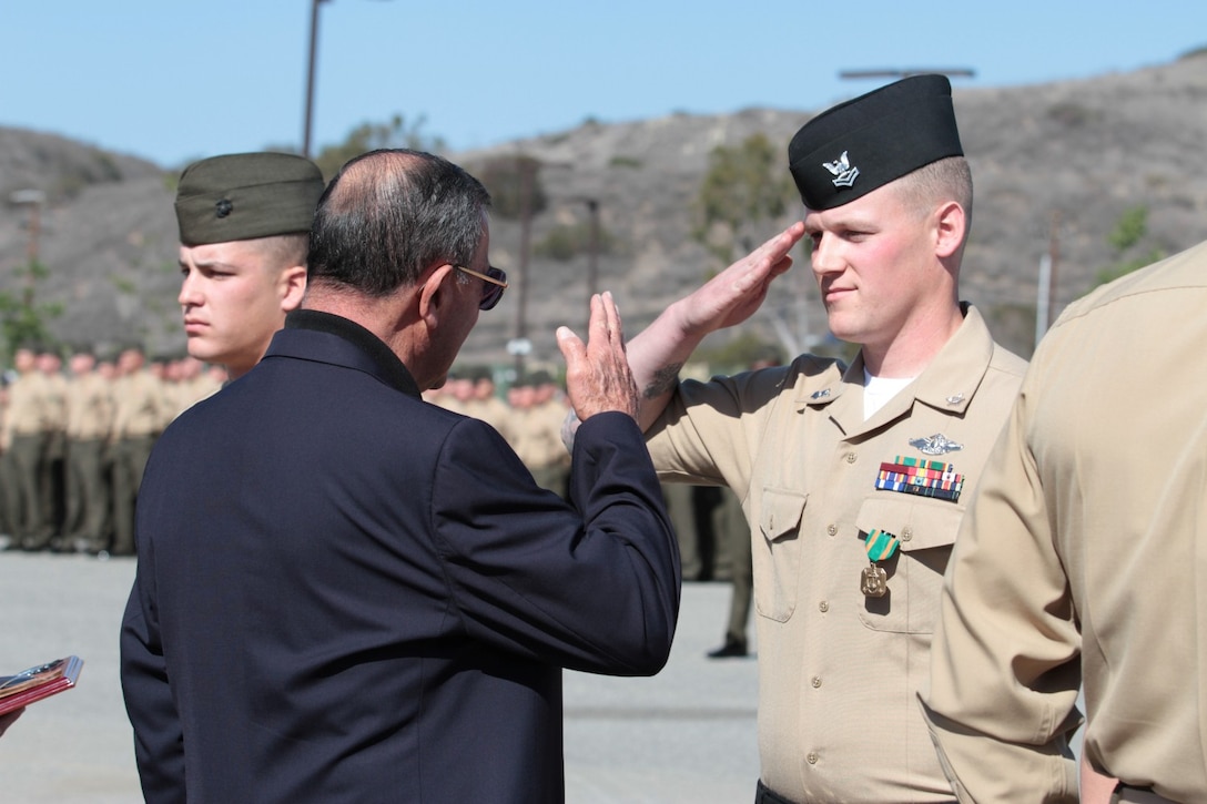 Hospital Corpsman 2nd Class David R. Wolf, assistant lead petty officer, battalion aid station, 2nd Battalion, 4th Marine Regiment, salutes Medal of Honor recipient, retired Col. Jay R. Vargas, after Wolf received his second Navy and Marine Corps Achievement Medal, as well as the HMCS Walter S. “Doc” Gorsage Leadership Award, during a ceremony at Marine Corps Base Camp Pendleton, Calif., Feb. 21, 2014. Vargas, who earned distinction while serving with 2nd Bn., 4th Marines in Vietnam, returned to his old battalion to congratulate the top performers. Wolf, a 27-year-old native of Grand Haven, Mich., and a 2004 graduate of Grand Haven High School, serves alongside infantrymen. He is trained to give first aid to wounded personnel on the battlefield, and he also cares for the health and welfare of each Marine in his unit. Wolf’s deployments include Afghanistan and Okinawa, Japan. Wolf is also a recipient of the Good Conduct Medal, Afghan Campaign Medal, National Defense Service Medal, and the Global War on Terrorism Service Medal.
(U.S. Marine Corps photo by Sgt. Jacob H. Harrer / cleared for release)
