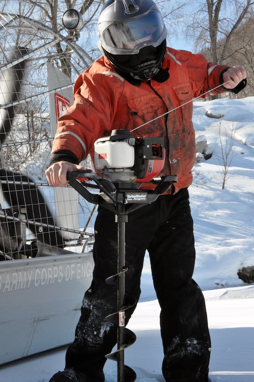 RED WING, Minn. – Bill Chelmowski, St. Paul District small boat operation and ice survey technician, prepares to drill a hole in the Mississippi River, near Lake City, Minn., Feb. 27, to measure the ice thickness within Lake Pepin. The Corps of Engineers measures the ice thickness every spring and the navigation industry uses the information to determine when to break through the ice and begin the shipping season. Lake Pepin ice is traditionally the last hurdle for the navigation industry to deal with before reaching St. Paul, because the ice is usually a lot thicker in the lake due to the slow moving current.                                                                                   