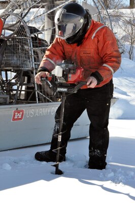 RED WING, Minn. – Bill Chelmowski, St. Paul District small boat operation and ice survey technician, prepares to drill a hole in the Mississippi River, near Lake City, Minn., Feb. 27, to measure the ice thickness within Lake Pepin. The Corps of Engineers measures the ice thickness every spring and the navigation industry uses the information to determine when to break through the ice and begin the shipping season. Lake Pepin ice is traditionally the last hurdle for the navigation industry to deal with before reaching St. Paul, because the ice is usually a lot thicker in the lake due to the slow moving current.                                                                                   