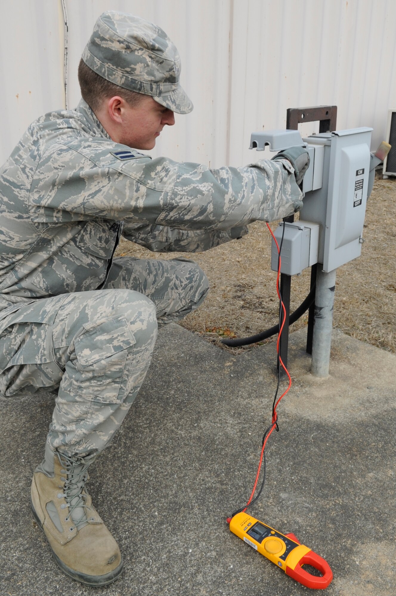 U.S. Air Force Airman 1st Class Michael Powell, 35th Civil Engineer Squadron electrical systems apprentice from Misawa Air Base, Japan, uses a digital multimeter to test the voltage of a power box in tent city during Exercise Key Resolve 2014 at Osan Air Base, Republic of Korea, Feb. 27, 2014. The 35 CES is responsible for maintaining more than 23 tents, two K-Spans, 12 storage containers and three latrines for augmented forces during the exercise. (U.S. Air Force photo/Senior Airman Marcus Morris)