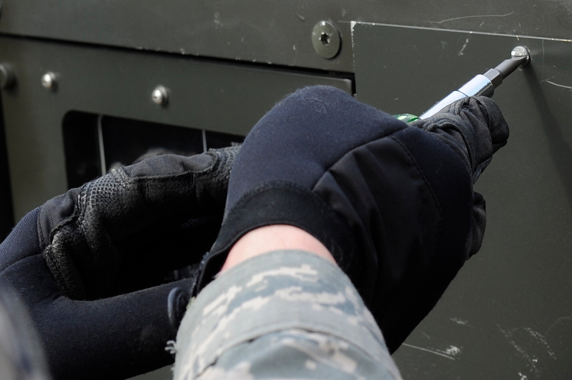 U.S. Air Force Staff Sgt. Emmanuel Santiago, 35th Civil Engineer Squadron HVAC systems technician, troubleshoots a broken Environmental Control Unit during Exercise Key Resolve 2014 at Osan Air Base, Republic of Korea, Feb. 27, 2014. The 35 CES is responsible for maintaining more than 65 ECUs, allowing the augmentees to rest and recover after their shifts. (U.S. Air Force photo/Senior Airman Marcus Morris)