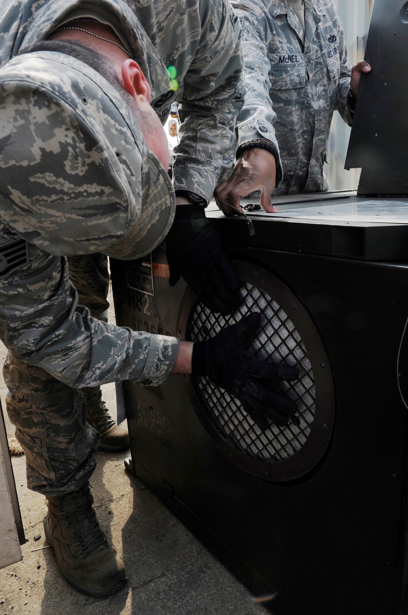 U.S. Air Force Staff Sgt. Emmanuel Santiago, 35th Civil Engineer Squadron HVAC systems technician, troubleshoots a broken Environmental Control Unit during Exercise Key Resolve 2014 at Osan Air Base, Republic of Korea, Feb. 27, 2014. The 35 CES is responsible for maintaining more than 65 ECUs, allowing the augmentees to rest and recover after their shifts. (U.S. Air Force photo/Senior Airman Marcus Morris)