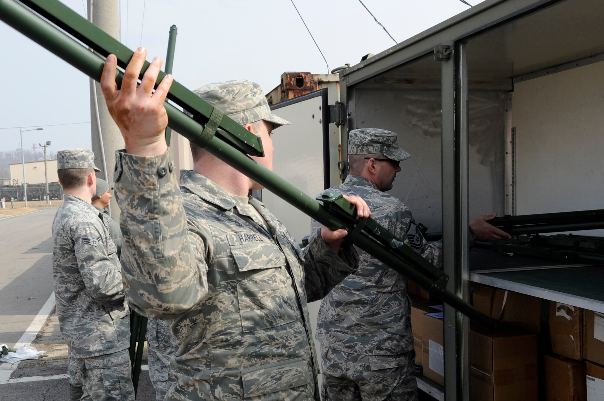 Members from the 35th Civil Engineer Squadron from Misawa Air Base, Japan, load a storage container with spare parts for tent city during Exercise Key Resolve 2014 at Osan Air Base, Republic of Korea, Feb. 27, 2014. The 35 CES maintains approximately $6 million of equipment for more than 500 augmentees residing in tent city. (U.S. Air Force photo/Senior Airman Marcus Morris)