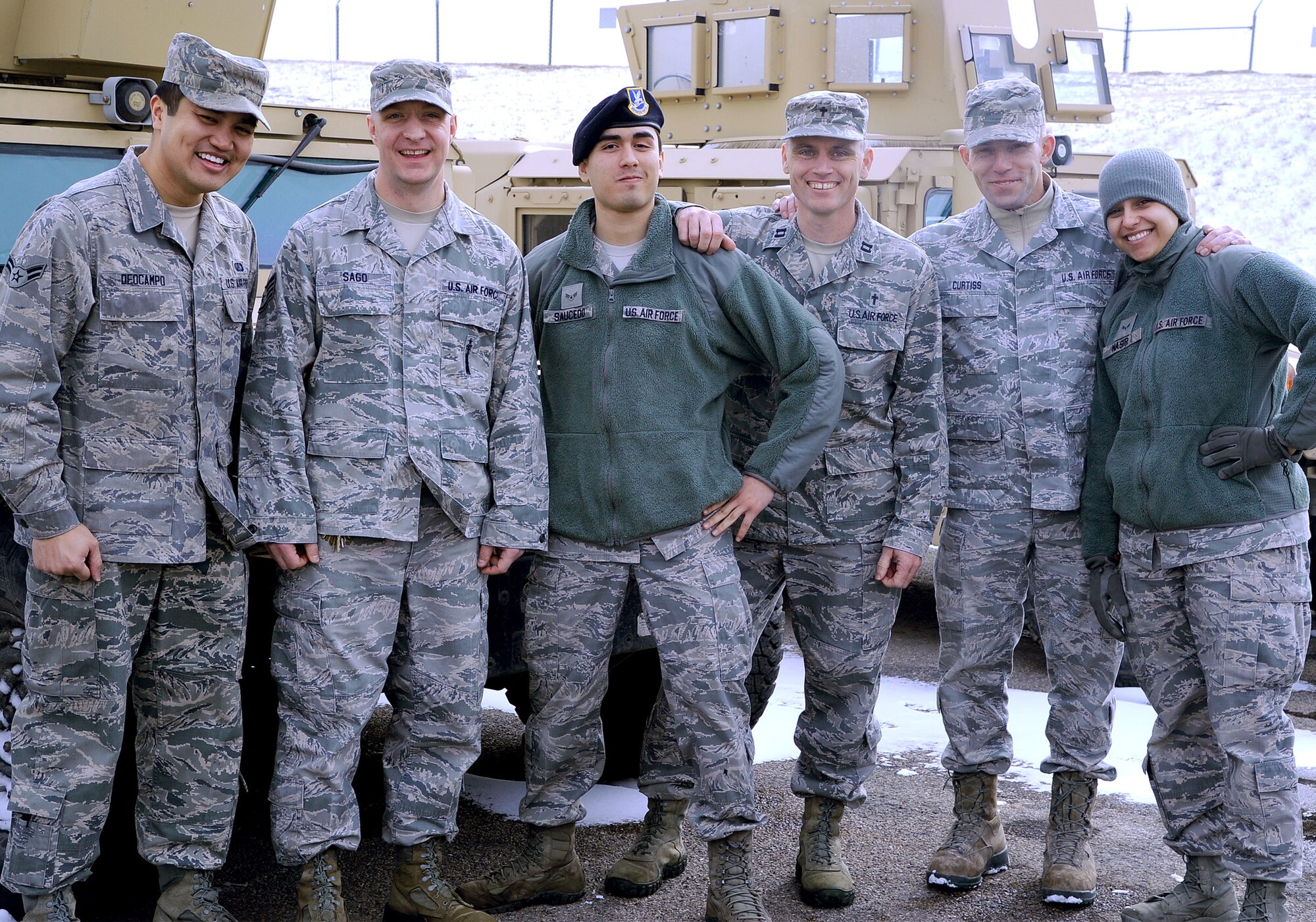 Airmen pose for a photograph with Chaplain (Capt.) Robert Compere, 341st Missile Wing chaplain, and Staff Sgt. William Curtiss, 341st MW chapel logistical readiness NCO in charge (center right), after spending time together at a missile alert facility Feb. 20. Chaplain teams routinely drive hundreds of miles to visit Airmen locally deployed in the missile field. During the Feb. 20 tour, the team logged nearly 400 miles. (U.S. Air Force photo/Airman 1st Class Collin Schmidt)