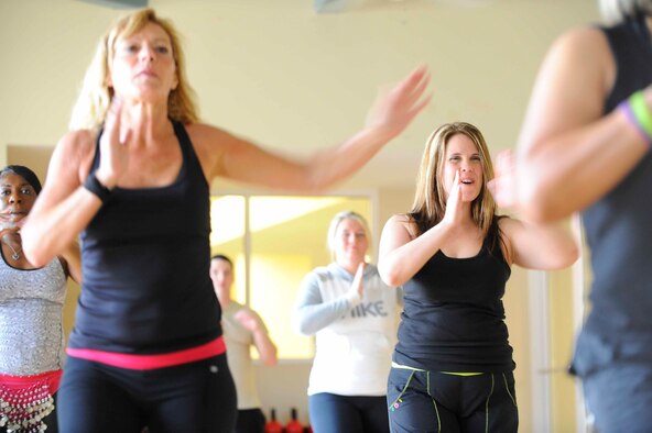 Susie Macdonald, Zumba instructor, dances with students during a Zumba class at the Riptide Gym on Hurlburt Field, Fla., Feb. 2, 2014. Each Zumba class is one hour. (U.S. Air Force photo/Airman 1st Class Andrea Posey)