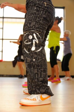 Zumba students line up for a choreographed dance at the Riptide Gym on Hurlburt Field, Fla., Feb. 2, 2014. Zumba is offered on Tuesdays and Thursdays at 11:00 a.m., and Monday through Thursday at 6:15 p.m. (U.S. Air Force photo/Airman 1st Class Andrea Posey)