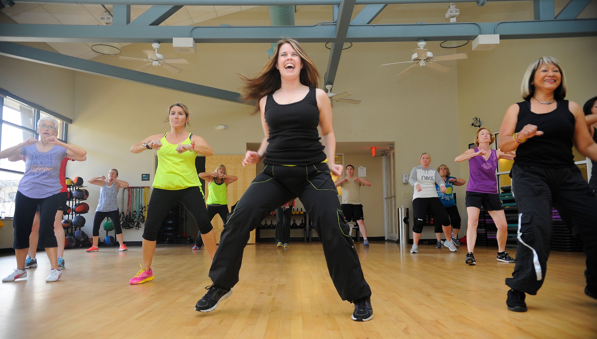 Susie Macdonald, Zumba instructor, leads a class at the Riptide Gym on Hurlburt Field, Fla., Feb. 2, 2014. Macdonald said dancing makes working out more fun. (U.S. Air Force photo/Airman 1st Class Andrea Posey)