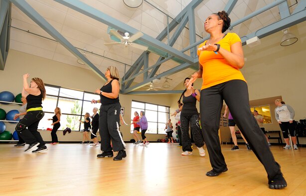 Base members begin a Zumba class at the Riptide Gym on Hurlburt Field, Fla., Feb. 2, 2014.  Zumba incorporates Latin rhythms and music from around the world, according to Susie Macdonald, Zumba instructor. (U.S. Air Force photo/Airman 1st Class Andrea Posey)