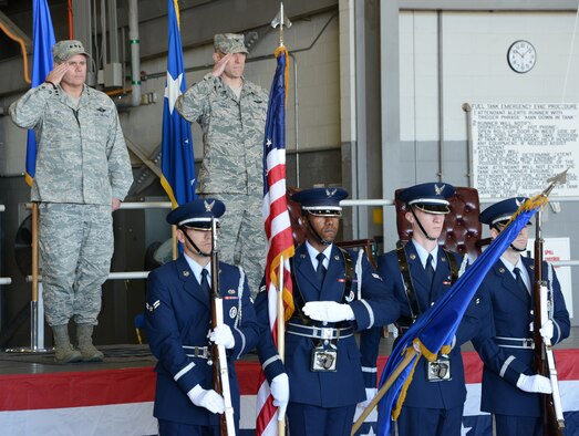 Lt. Gen. Eric Fiel, Air Force Special Operations Command commander, and Col. David Tabor salute during the playing of the national anthem at the Air Force Special Operations Air Warfare Center assumption of command ceremony at Duke Field, Fla., Feb. 27, 2014. Tabor took command of AFSOAWC in front of family and friends. (U.S. Air Force photo by Master Sgt. Steven Pearsall)  