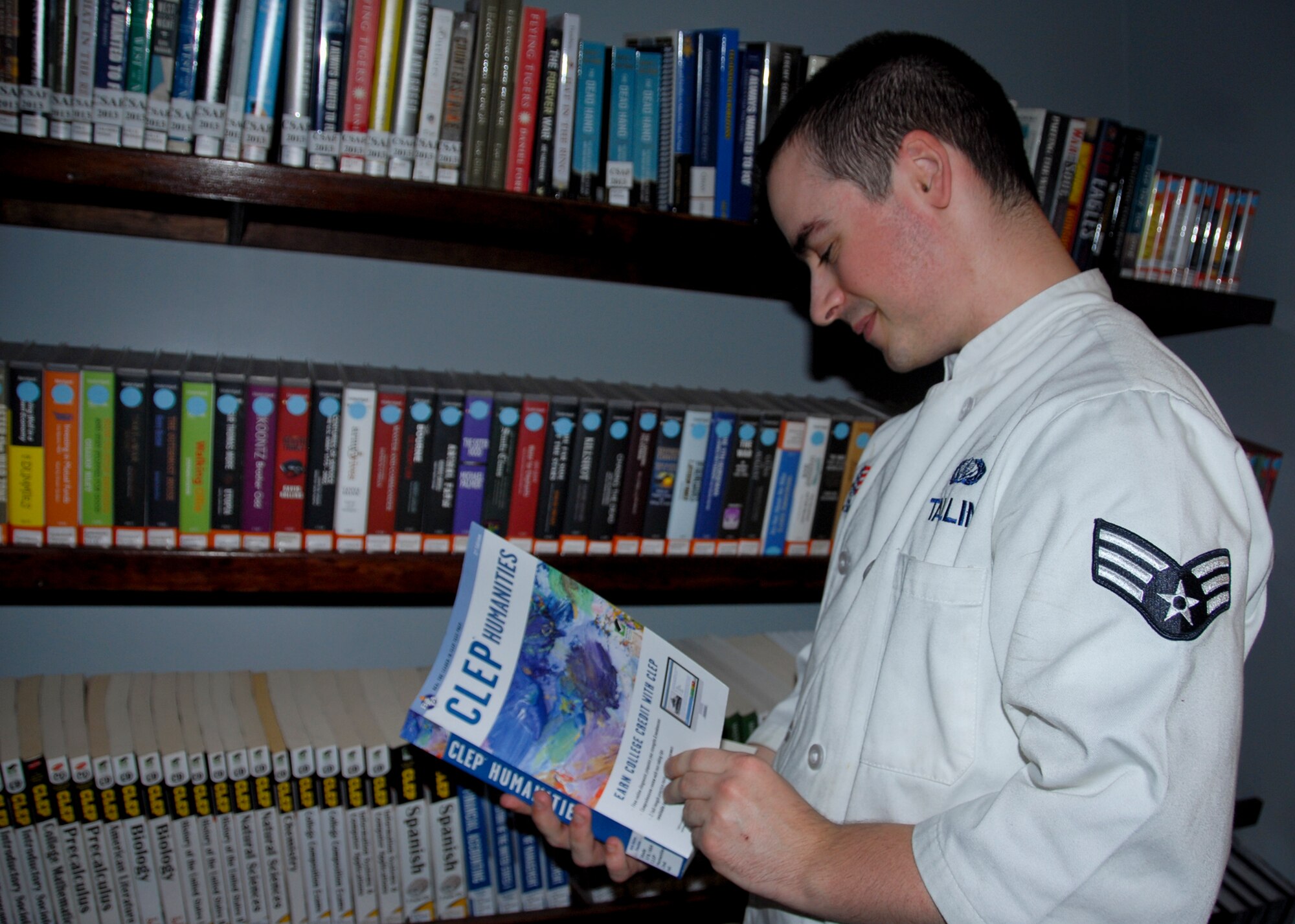 Senior Airman Robert Tallini, of the 96th Force Support Squadron, researches a College Level Examination Program on humanities classes at Hangar 3, Eglin’s new digital library. It is part of Community Commons, which combines access to FSS programs and information into one convenient location. (U.S. Air Force photo/Kevin Gaddie)