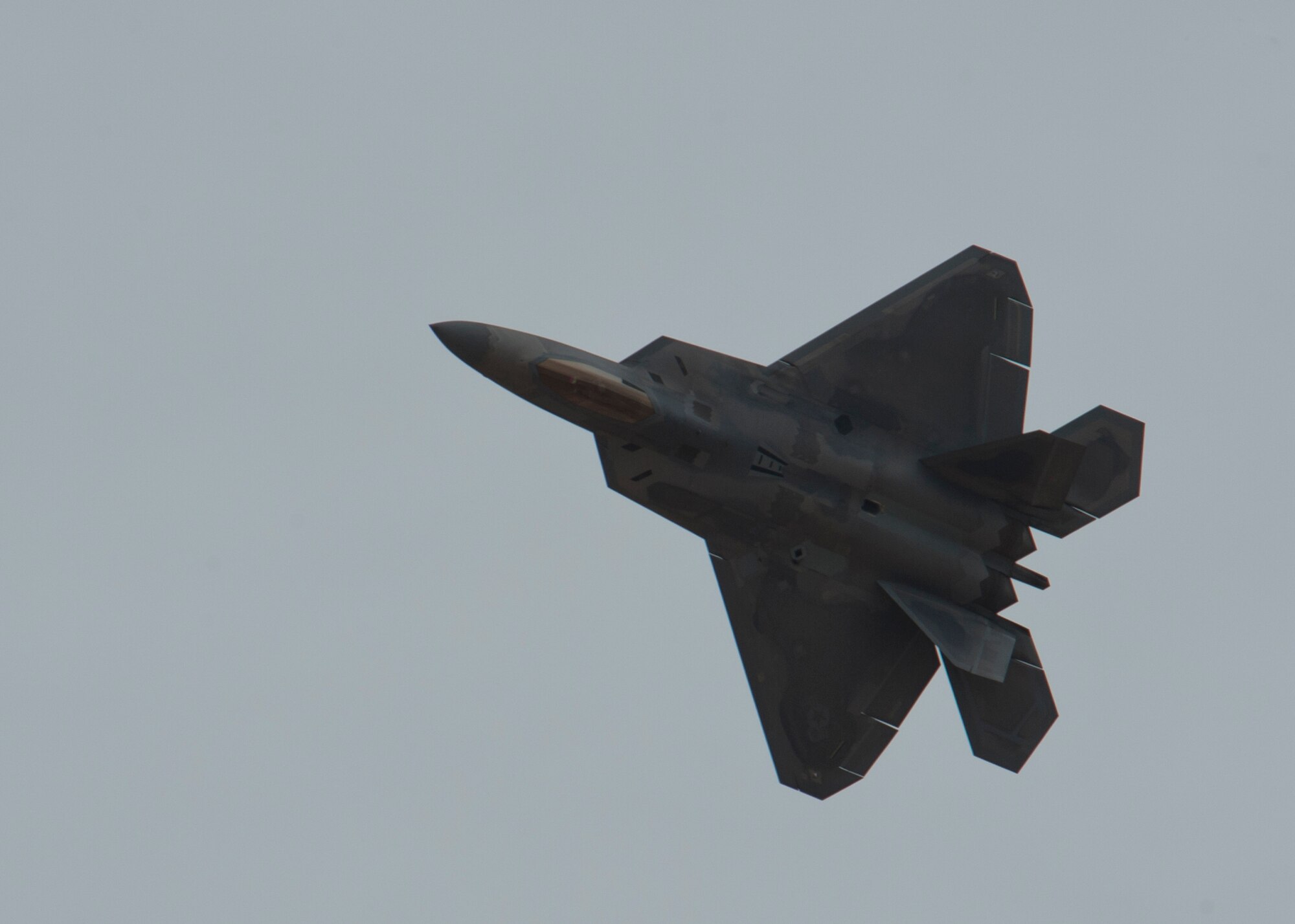 Captain John Cummings, F-22 Raptor Demo Team pilot, performs maneuvers during a practice run of the F-22 aerial demonstration used at events at Holloman Air Force Base, N.M., Feb. 4. The F-22 Demo Team will perform twice during the upcoming Open House held at Holloman on May. 10. (U.S. Air Force photo by Airman 1st Class Aaron Montoya/Released)