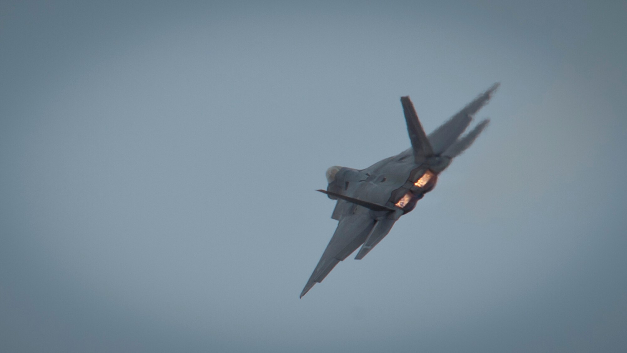 Captain John Cummings, F-22 Raptor Demo Team pilot, performs maneuvers during a practice run of the F-22 aerial demonstration used at events at Holloman Air Force Base, N.M., Feb. 4. The F-22 Demo Team will perform twice during the upcoming Open House held at Holloman on May. 10. (U.S. Air Force photo by Airman 1st Class Aaron Montoya/Released)