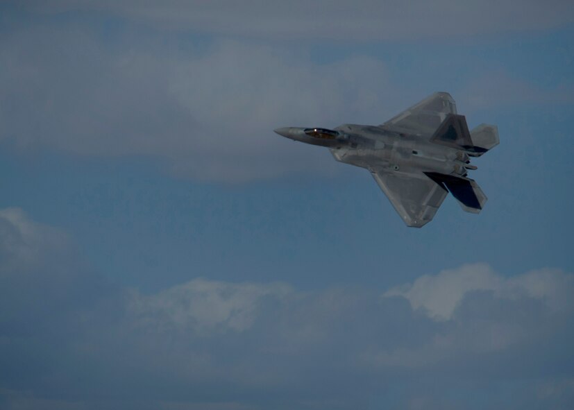 Captain John Cummings, F-22 Raptor Demo Team pilot, performs maneuvers during a practice run of the F-22 aerial demonstration used at events at Holloman Air Force Base, N.M., Feb. 4. The F-22 Demo Team will perform twice during the upcoming Open House held at Holloman on May. 10. (U.S. Air Force photo by Airman 1st Class Aaron Montoya/Released)