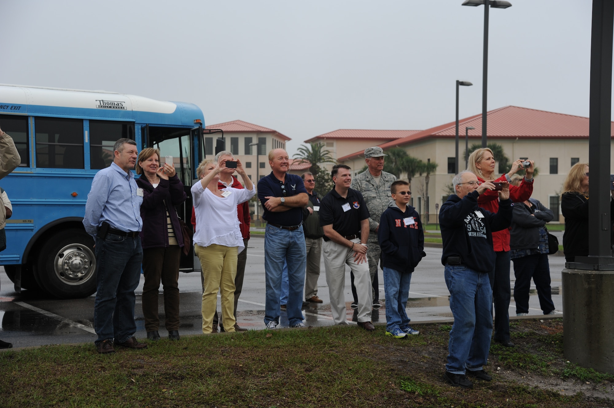 Alumni of the 927th Air Refueling Wing and their families watch as three KC-135 Stratotankers take off for a formation flight at MacDill Air Force Base, Fla. Feb. 8, 2014.  Former members of the 927th ARW spent the day touring the base and catching up with friends during a weekend reunion at MacDill.  