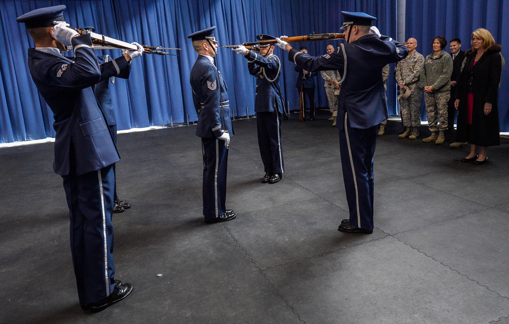 Secretary of the Air Force Deborah Lee James watches as The U.S. Air Force Drill Team perform their demonstration routine during an immersion tour at Joint Base Anacostia-Bolling, D.C., Feb. 7, 2014. The team performs drill movements with a fully-functional M-1 rifle in intricate, constantly changing formations.  The USAF Drill Team’s mission is to promote the Air Force mission by showcasing drill performances at public and military venues to recruit, retain, and inspire Airmen. (U.S. Air Force photo/Jim Varhegyi)