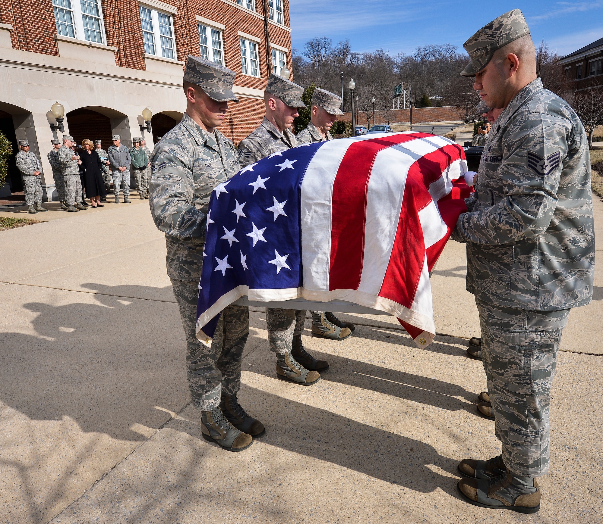 Secretary of the Air Force Deborah Lee James watches as The U.S. Air Force Honor Guard Body Bearers demonstrate their duties during an immersion tour at Joint Base Anacostia-Bolling, D.C., Feb. 7, 2014. The Body Bearers Flight participates in U.S. Air Force, joint service and state funerals by carrying the remains of deceased service members, their dependents and senior or national leaders to their final resting places at Arlington National Cemetery.  (U.S. Air Force photo/Jim Varhegyi)
