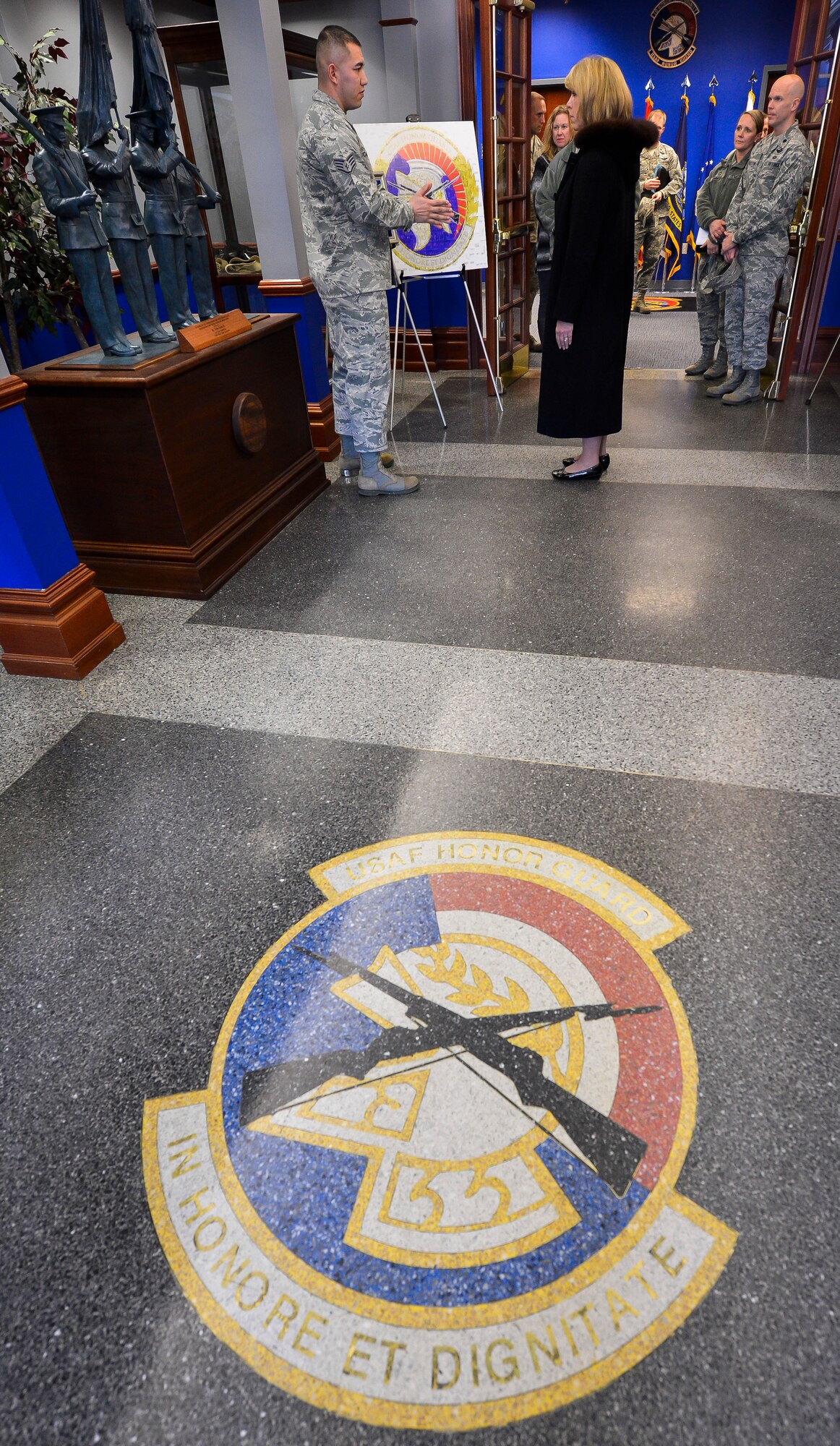 Staff Sgt. Alfredo Caballero explains The U.S. Air Force Honor Guard’s heritage with Secretary of the Air Force Deborah Lee James during an immersion tour at Joint Base Anacostia-Bolling, D.C., Feb. 7, 2014. Caballero is a USAF Honor Guard ceremonial guardsman. The USAF Honor Guard originated in 1948 when Headquarters Command, U.S. Air Force, directed the creation of an elite ceremonial unit.  The ceremonial unit was activated within the 1100th Air Police Squadron at Bolling Air Force Base, Washington, D.C., with the responsibility of maintaining an Air Force ceremonial capability in the National Capital Region.  (U.S. Air Force photo/Jim Varhegyi)