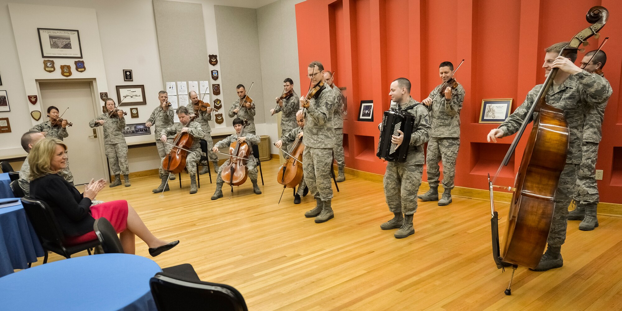 Secretary of the Air Force Deborah Lee James listens to the Air Force Strings perform for her during an immersion tour at Joint Base Anacostia-Bolling, D.C., Feb. 7, 2014. The Air Force Strings is one of the most diverse and flexible units of The U.S. Air Force Band. This wide-ranging flexibility allows the ensemble to musically respond to the requirements of almost any occasion. (U.S. Air Force photo/Jim Varhegyi)