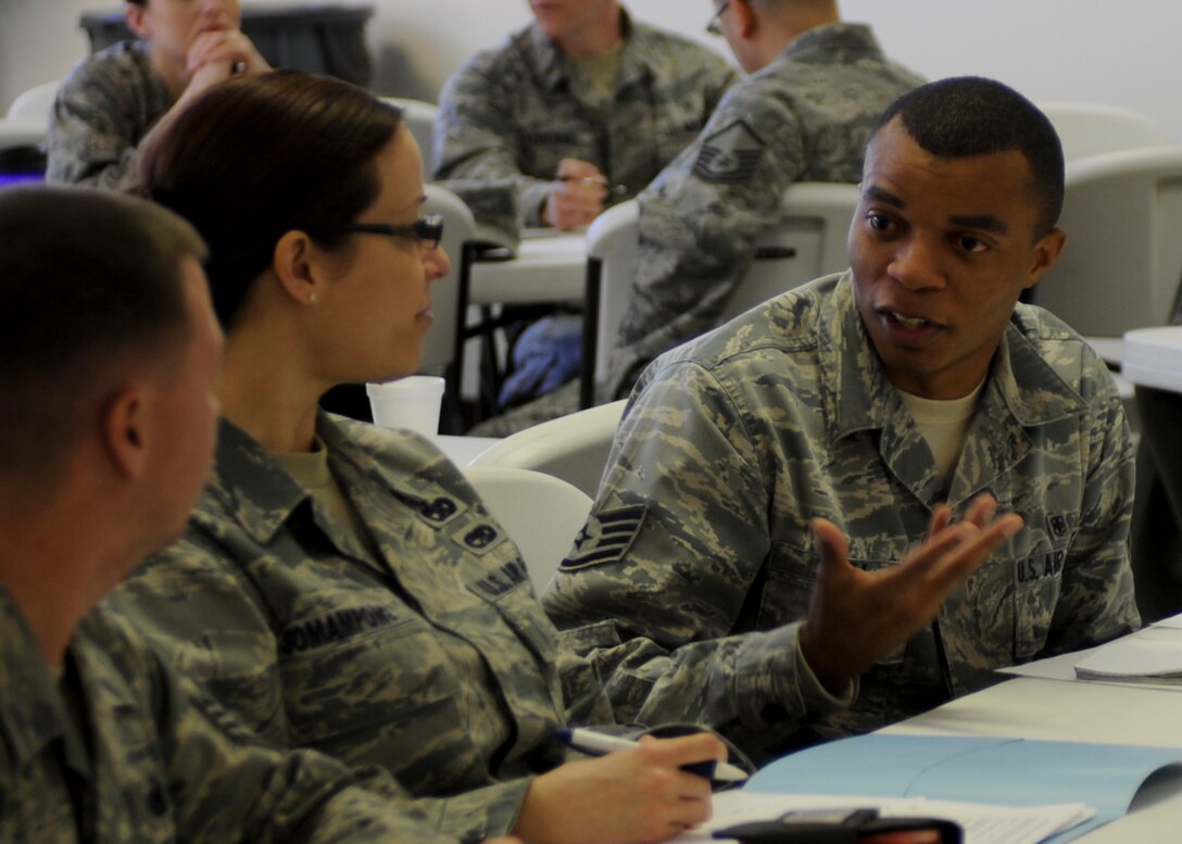 Staff Sgt. Sylvester Snell, 28th Medical Operations Squadron public health technician, discusses his vision for events with fellow classmates during a group exercise as part of a Comprehensive Airman Fitness training course in the Freedom Chapel at Ellsworth Air Force Base, S.D., Feb. 20, 2014. Snell, along with others in attendance, will be leading CAF Day activities in their respective units Feb. 27. (U.S. Air Force photo by Senior Airman Anania Tekurio/Released)