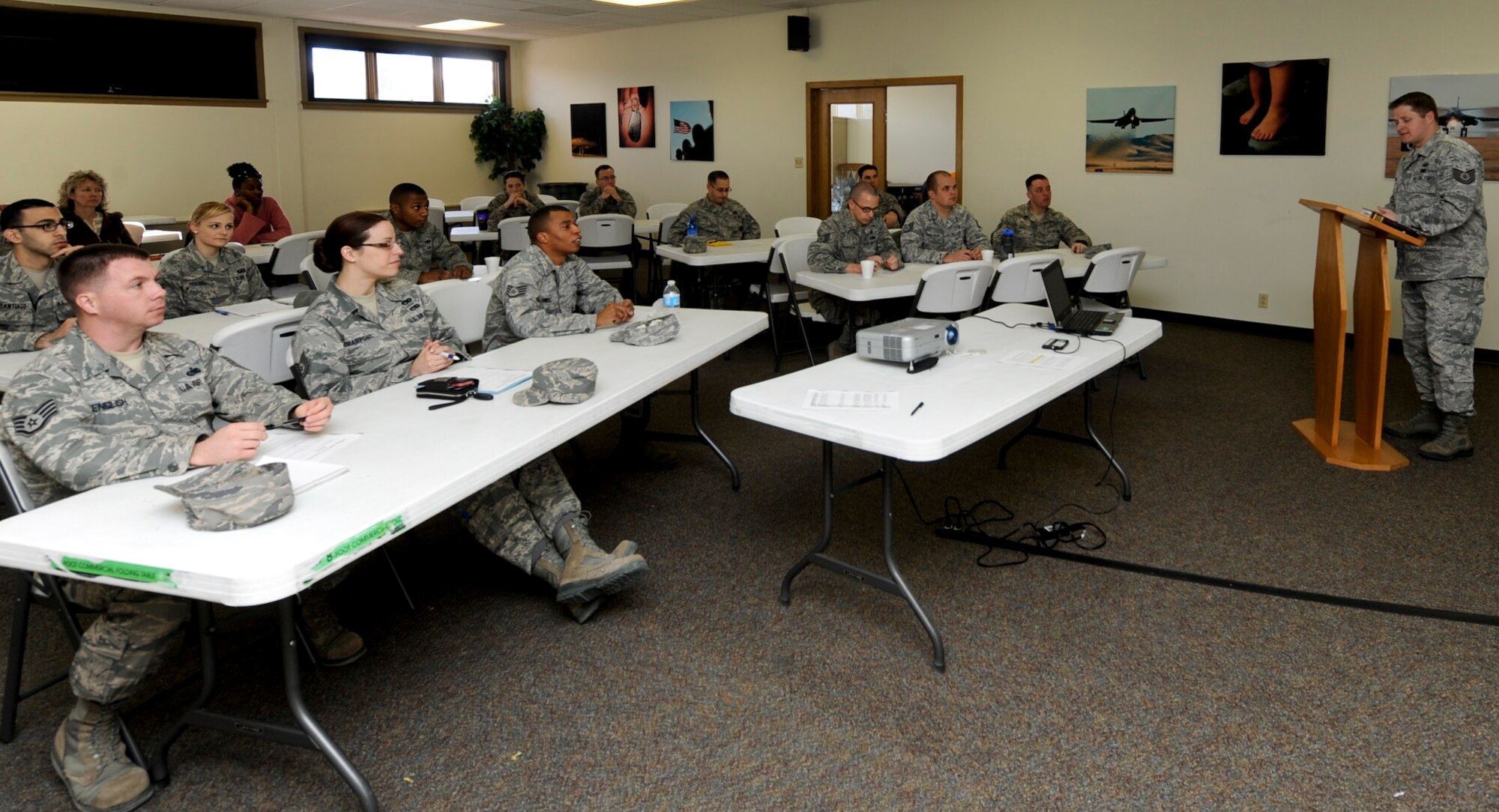 Tech. Sgt. John McIntosh, 28th Bomb Wing NCO in charge of chapel operations, prepares Airmen to be facilitators for the upcoming Comprehensive Airman Fitness Day during a CAF training course in the Freedom Chapel at Ellsworth Air Force Base, S.D., Feb. 20, 2014. Spiritual wellness and religious tolerance in the workplace is the focus of the next CAF Day, Feb. 27. (U.S. Air Force photo by Senior Airman Anania Tekurio/Released)