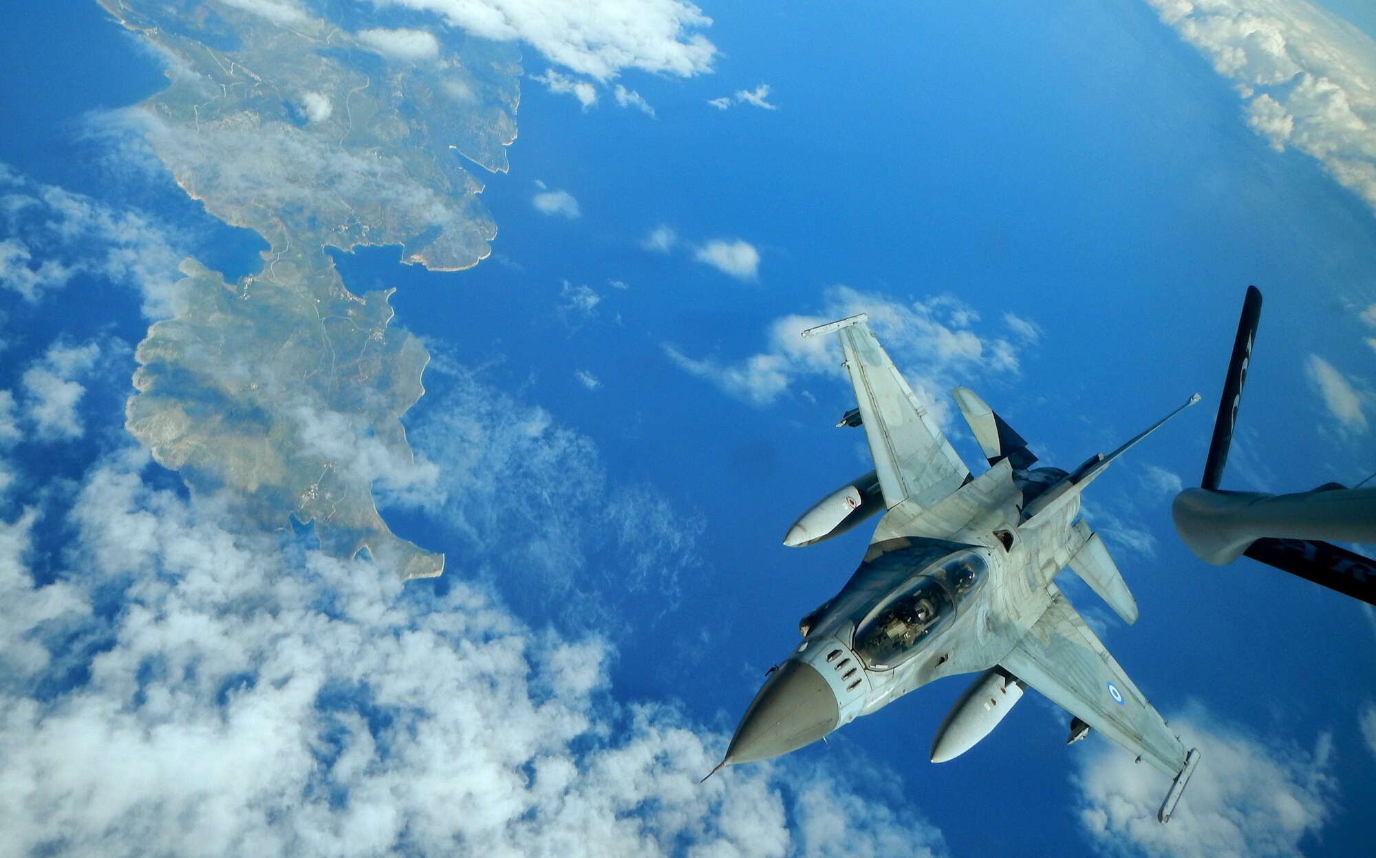 An Hellenic air force F-16 fighter jet practices refueling procedures with a U.S. Air Force KC-135 Stratotanker during a NATO exercise above the Mediterranean Sea, Feb. 26, 2014. The KC-135 is deployed from Royal Air Force Mildenhall, England, to support bilateral training with Greek allies. (U.S. Air Force photo by Staff Sgt. Thomas Trower/Released)