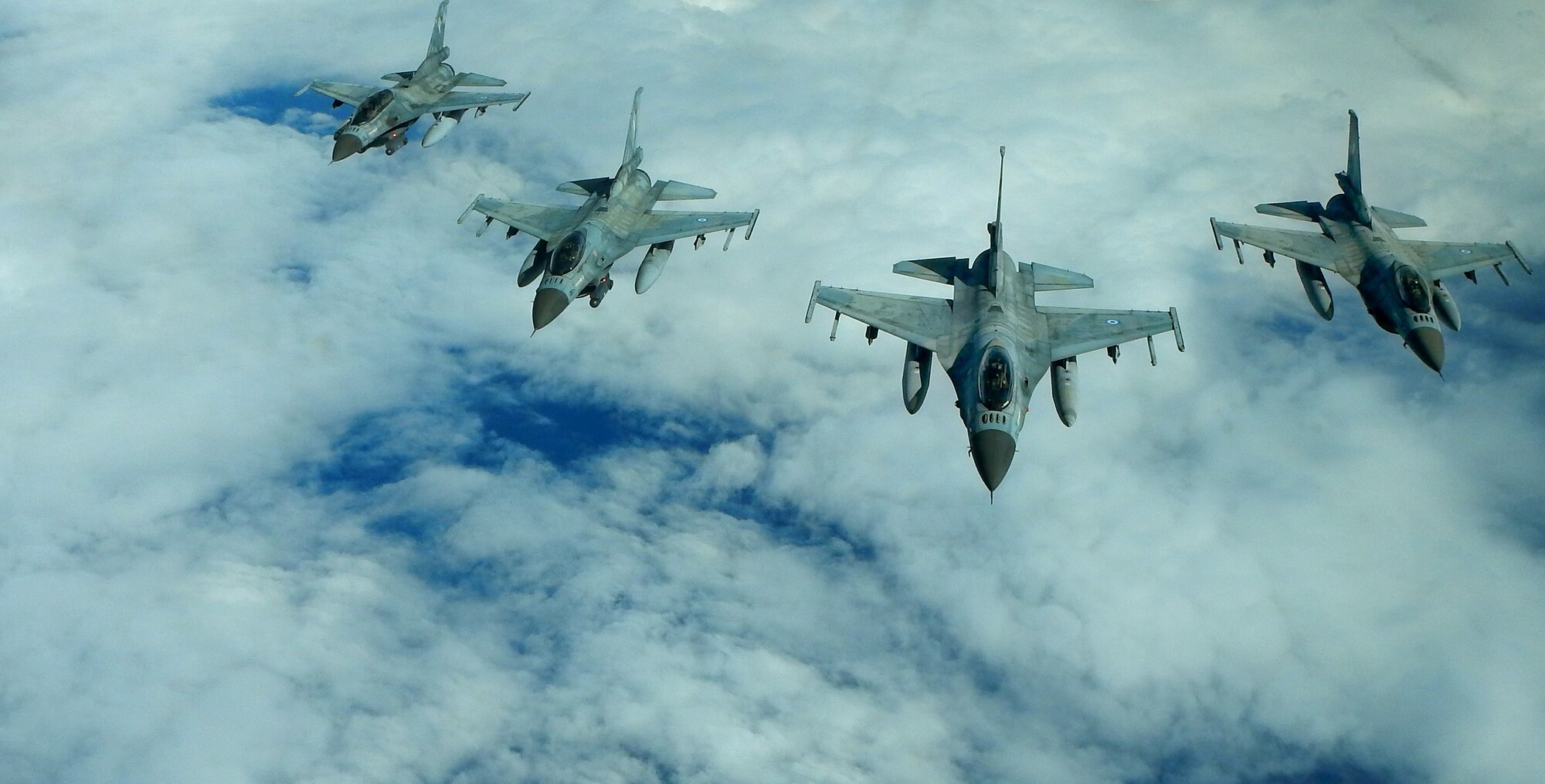 Hellenic air force F-16 fighter jets fly in formation over the Mediterranean Sea during a NATO exercise with the U.S. Air Force, Feb. 26, 2014. The F-16s are stationed at Souda Air Base in the 115th Combat Wing on the island of Crete. (U.S. Air Force photo by Staff Sgt. Thomas Trower/Released)
