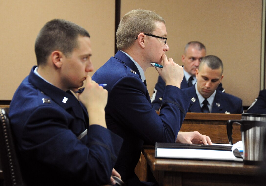 The prosecution watches intently during a mock trial Feb. 25 at the base support court room. “Grey Matters” was a realistic, condensed sexual assault trial and intended to teach the audience as well as the jury, the proceedings and intensity of an actual court-martial and how grey the area of consent is. (U.S. Air Force photo by Airman 1st Class Alex Echols)
