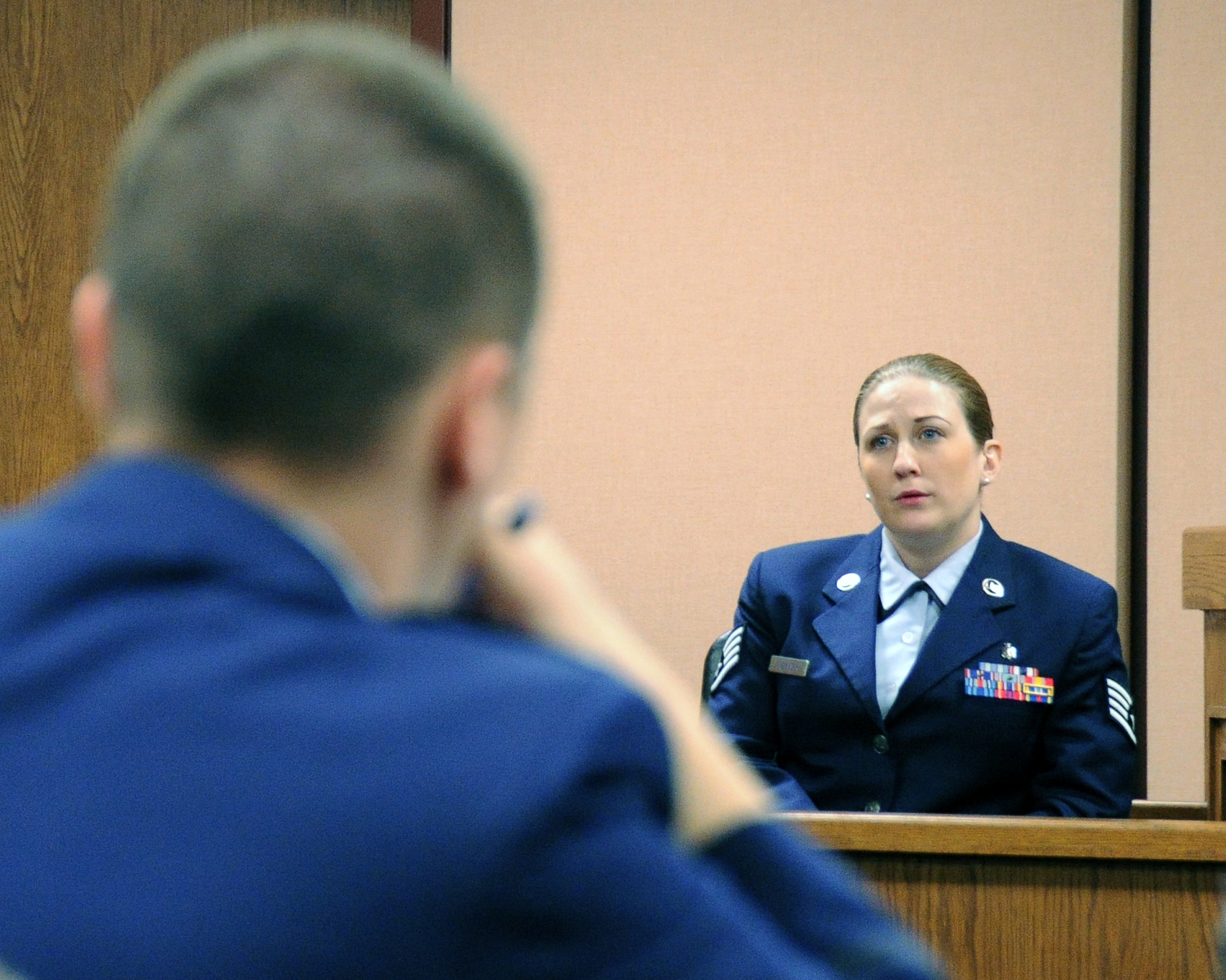 Staff Sgt. Sabrina K. Overmyer, 325th Medical Group preventive dentistry NCO in charge and alleged victim, tells her story during a mock trial Feb. 25 at the base support court room. “Grey Matters” was a realistic, condensed sexual assault trial and intended to teach the audience as well as the jury, the proceedings and intensity of an actual court-martial and how grey the area of consent is. (U.S. Air Force photo by Airman 1st Class Alex Echols)