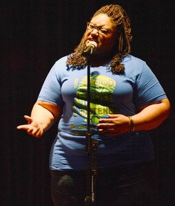Photo by Airman 1st Class Krystal Ardrey
Andrea Sanderson recites a poem she wrote during the 4th Annual Teen Dating Violence Awareness Poetry Slam Saturday at the Military and Family Readiness Center on Joint Base San Antonio-Fort Sam Houston.