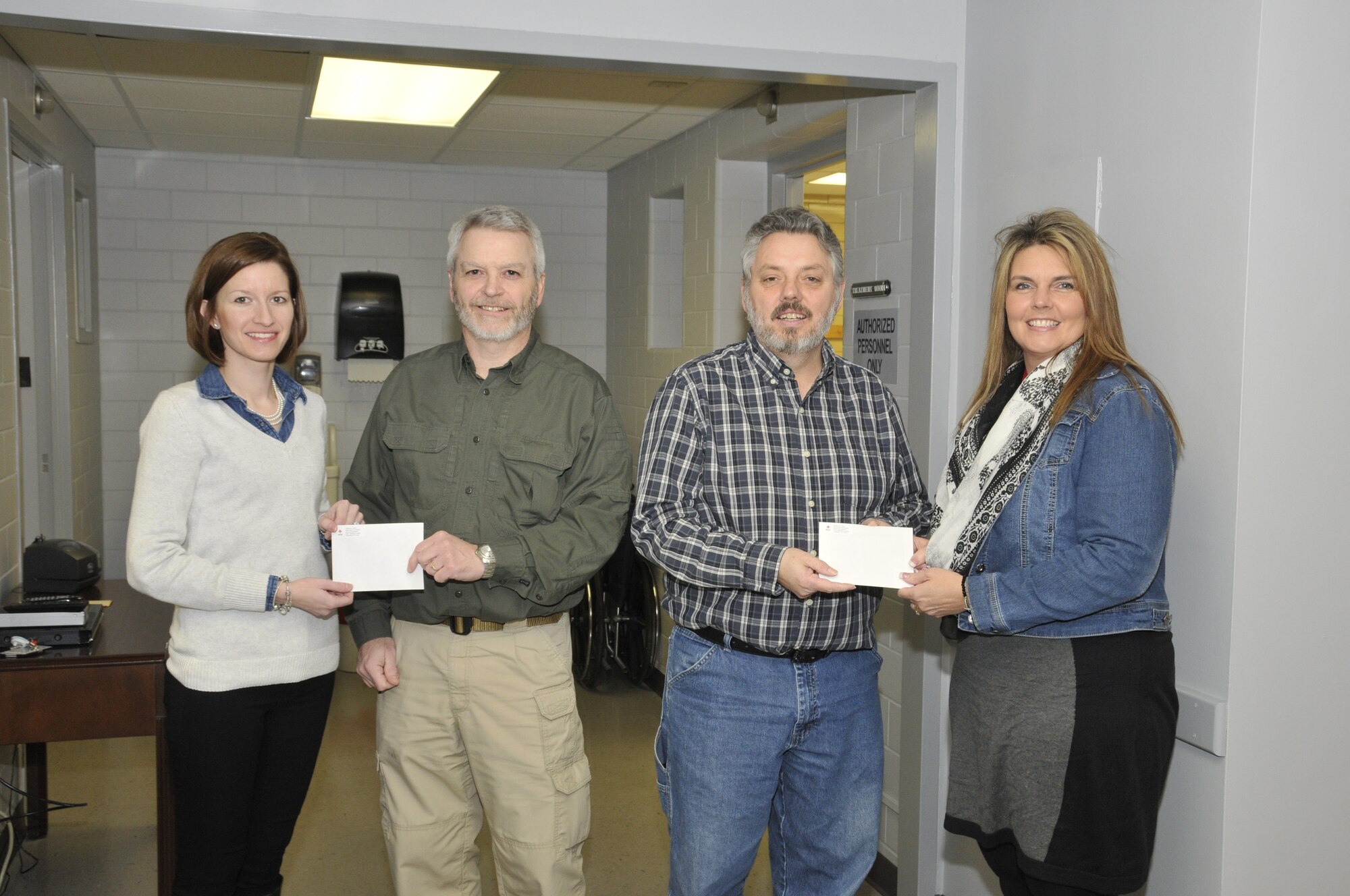 The American Red Cross’s January two-day blood drive was a success with 45 employees donating, exceeding the Red Cross goal and resulting in 134 potential lives saved. Participating donors were registered to win $25 gas cards provided by the American Red Cross – one for each day of the drive. Left to right: Emily Fair, a Comprehensive Occupational Resources (CORE) medical technician and a blood drive coordinator for ATA, presents a gift card to Douglas Ratliff, an ATA Flight Systems Acquisition Engineer. Michael Sain, an ATA Precision Measurement Equipment Laboratory (PMEL) instrument technician, receives a gift card from Lana Butaud, a Red Cross representative.