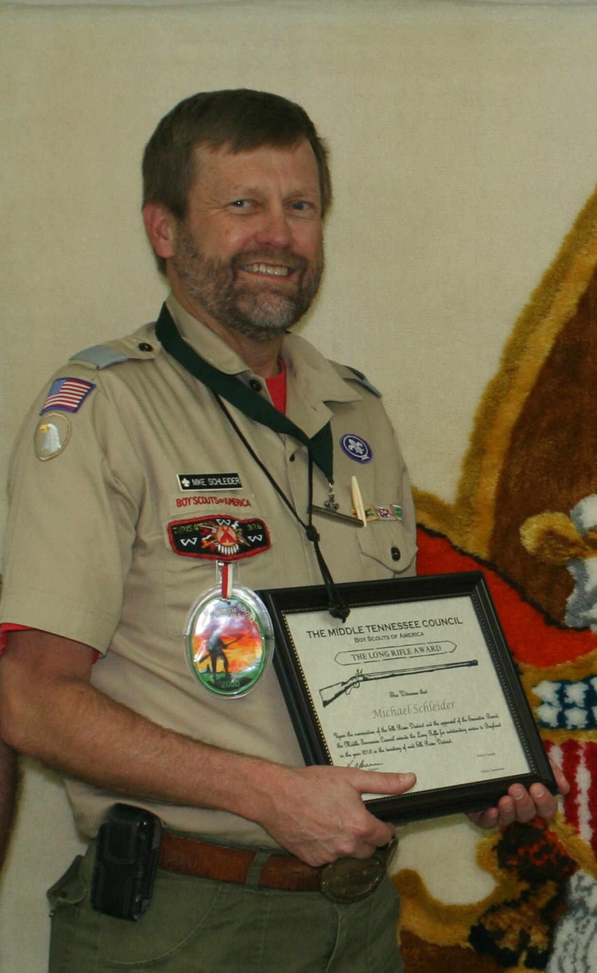 Michael Schleider, AEDC director of Engineering and Technical Management and Elk River District Boy Scouts District Advancement Chairman, recently received the Boy Scouts of America Middle Tennessee Council Long Rifle Award. He received this District Award of Merit at the Elk River District Adult Volunteer Recognition and 2013 Eagle Scout Banquet. The Long Rifle Award honors local unit and district-level scouters as selected by the local district committees and is presented for noteworthy service of exceptional character. The award, worn around Schleider’s neck, is a miniature long rifle pendant fashioned after the long rifle that was used by Tennessee pioneers and is suspended from a green ribbon. (Photo by Michael Glennon)