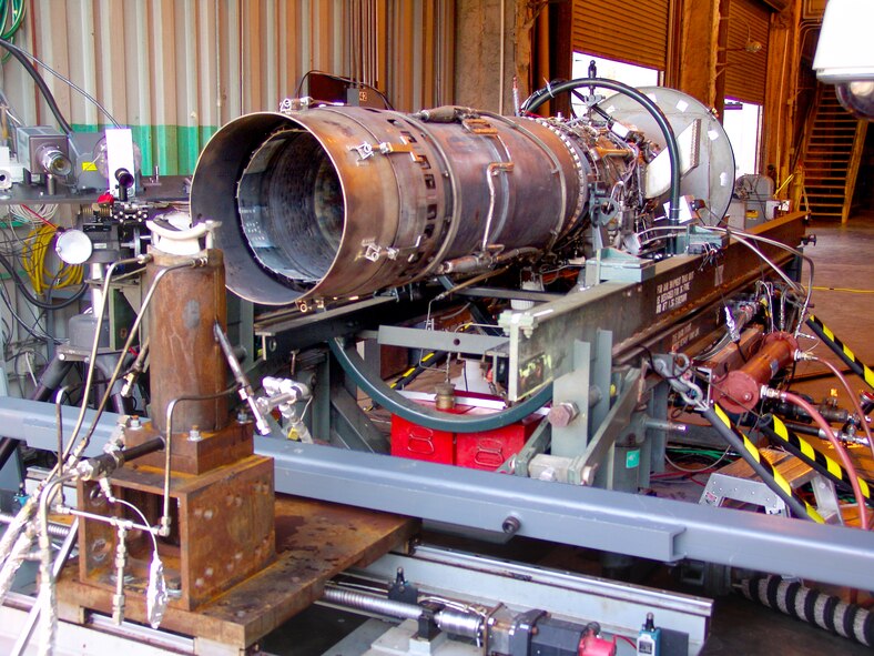 Thermographic phosphor techniques were demonstrated in the exhaust flow of an AEDC J85 afterburning engine at the University of Tennessee Space Institute Propulsion Research Facility. This photo shows the test article mounted behind the J85 engine. (Photo provided)