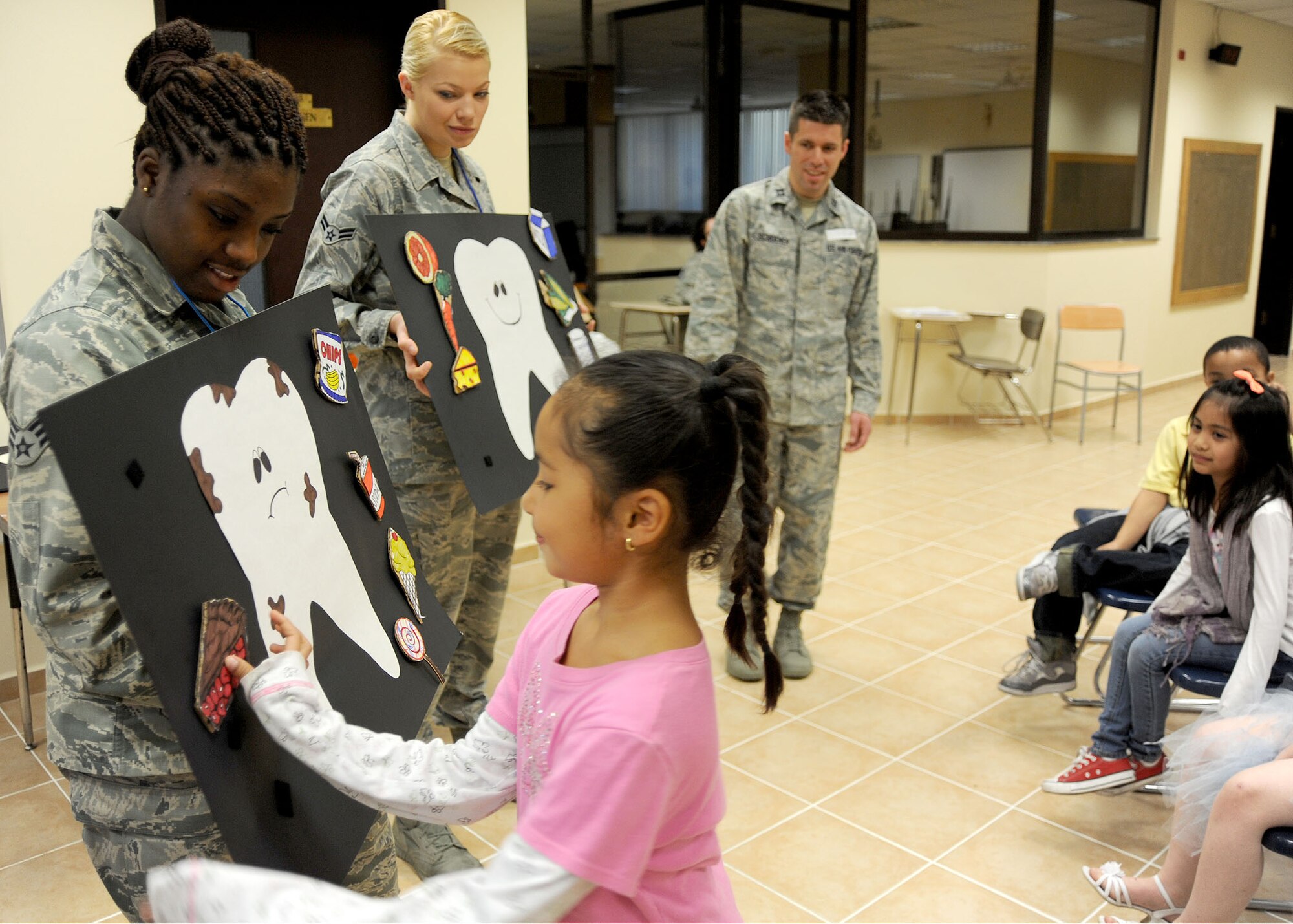 INCIRLIK AIR BASE, Turkey—Gabriana, 6, a student at the Incirlik Unit School, participates in an educational  hands-on dental hygiene game during a presentation by Airmen from the 39th Medical Group Dental Clinic Feb. 26, 2014, Incirlik Air Base, Turkey.  February is National Children’s Dental Health Month. During this month the dental clinic educated 238 students on proper oral hygiene, and hosted a children’s dental clinic called “Little Teeth, Big Smiles” providing dental examination for 39 children.  (U.S. Air Force photo by Staff Sgt. Veronica Pierce/Released)                           