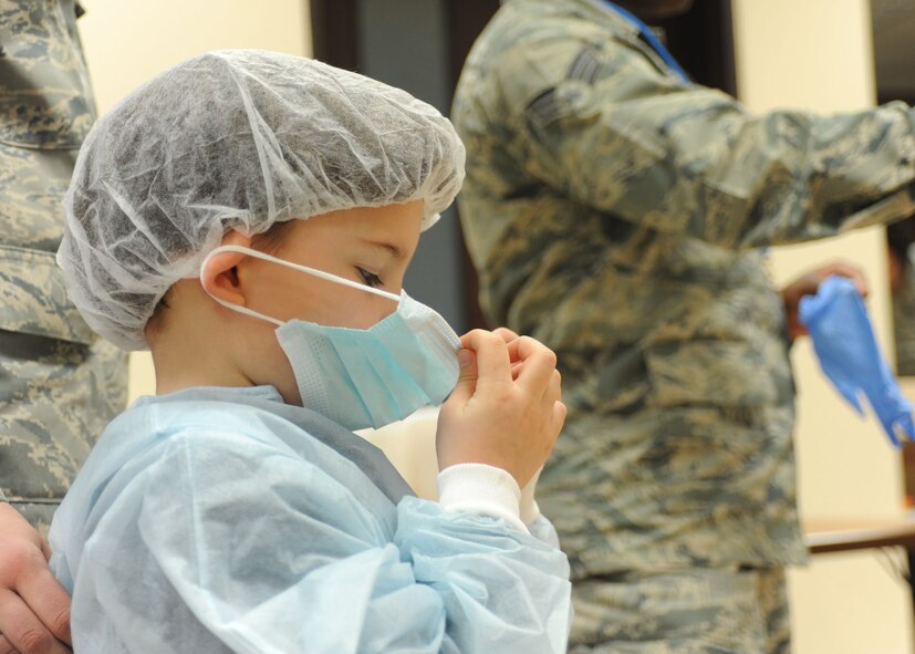 INCIRLIK AIR BASE, Turkey—Diego, 7, a student at the Incirlik Unit School, is dressed in protective medical garments during a presentation by Airmen with the 39th Medical Group Dental Clinic Feb. 26, 2014, Incirlik Air Base, Turkey. The Dental Clinic visited students in kindergarten through fifth grade at school in conjunction with National Children’s Dental Health Month. (U.S. Air Force photo by Staff Sgt. Veronica Pierce/Released)                           