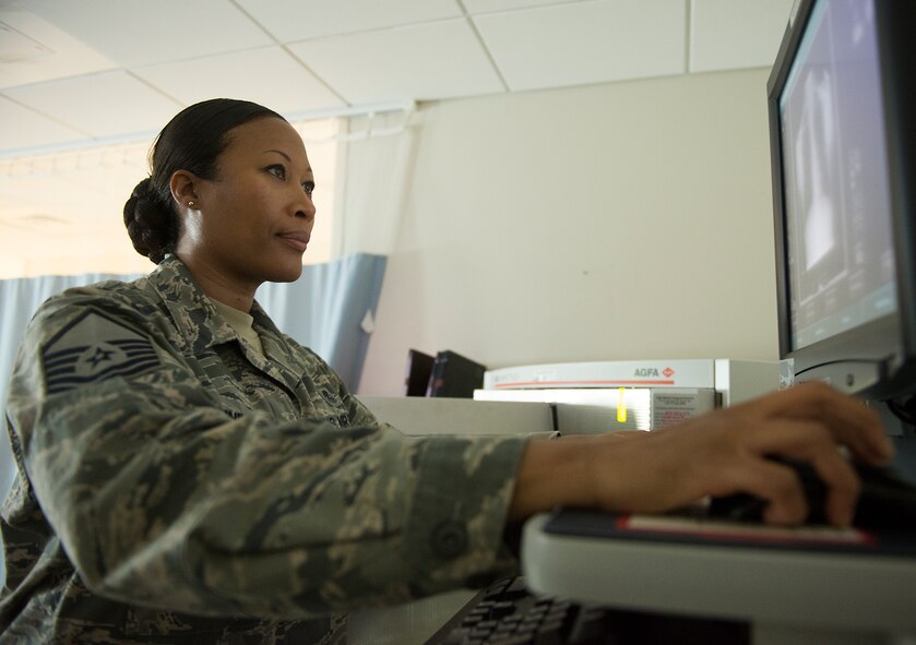 U.S. Air Force Master Sgt. Tracey McLendon, 23d Medical Support Squadron diagnostic imaging flight chief, processes X-ray images at the hospital on Moody Air Force Base, Ga., Feb. 25, 2014. The 23d MDSS radiology clinic supports personnel in the 23d Wing, 23d Air Ground Operations Wing to include the military work dogs. (U.S. Air Force photo by Senior Airman Tiffany M. Grigg/Released)