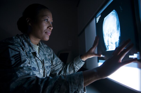 U.S. Air Force Master Sgt. Tracey McLendon, 23d Medical Support Squadron diagnostic imaging flight chief, examines an X-ray for possible skull fracture at the clinic on Moody Air Force Base, Ga., Feb. 25, 2014. The 23d MDSS radiology clinic averages 220 exams per month. (U.S. Air Force photo by Senior Airman Tiffany M. Grigg/Released) 