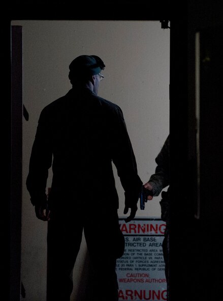 ZB-6 Marco Lorenz, 86th Security Forces Squadron tactical instructor, exits a training facility after completing a simulated active shooter training scenario Feb. 25, 2014, Ramstein Air Base, Germany. German civilian security police are an integral part to the overall security of Ramstein. (U.S. Air Force photo/Airman 1st Class Jordan Castelan)
