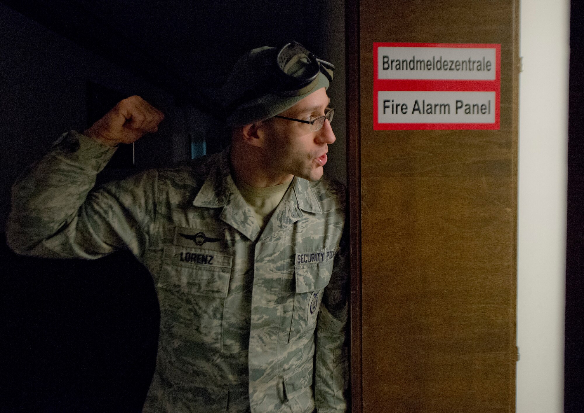 ZB-6 Marco Lorenz, 86th Security Forces Squadron tactical instructor, yells into a room for all training participants to evacuate the room during a simulated active shooter training scenario Feb. 25, 2014, Ramstein Air Base, Germany. German civilian security police are an integral part to the overall security of Ramstein. (U.S. Air Force photo/Airman 1st Class Jordan Castelan)