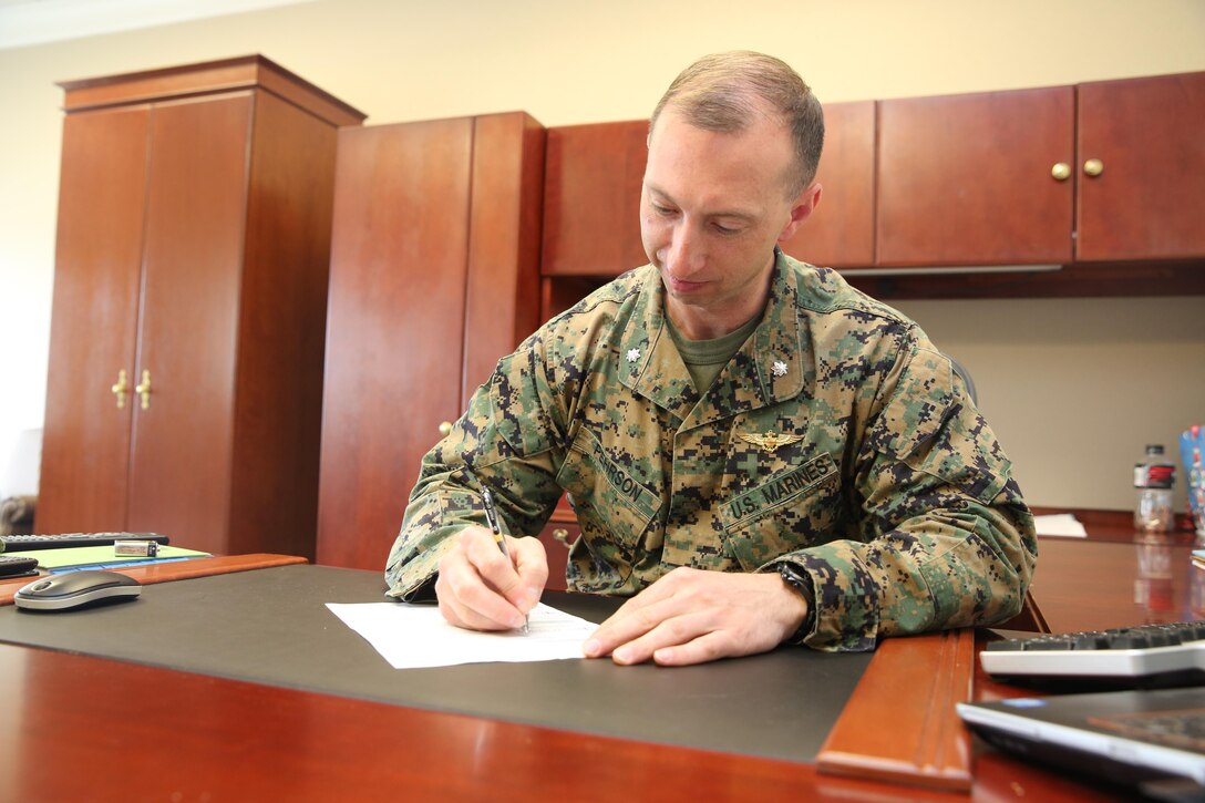 Lt. Col. Troy M. Pehrson signs an allotment form for the Navy-Marine Corps Relief Society’s annual active duty fund drive at Cherry Point Feb. 25. The fund drive kicks off March 1 and runs through the end of the month. Pehrson is the executive officer of Marine Corps Air Station Cherry Point.
