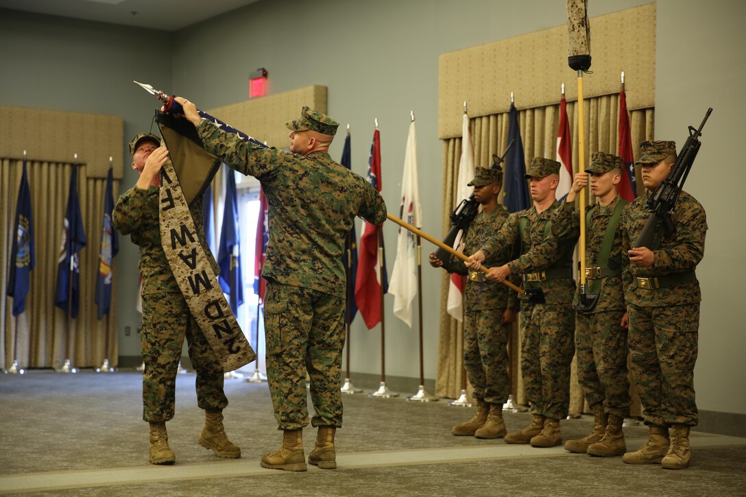 Col. Scott S. Jensen, commanding officer of 2nd Marine Aircraft Wing (Forward), and Sgt. Maj. Thomas W. Foster, sergeant major of 2nd MAW (Fwd.), case the unit's colors during a deactivation ceremony at Marine Corps Air Station Cherry Point, N.C., Feb. 19, 2014.


