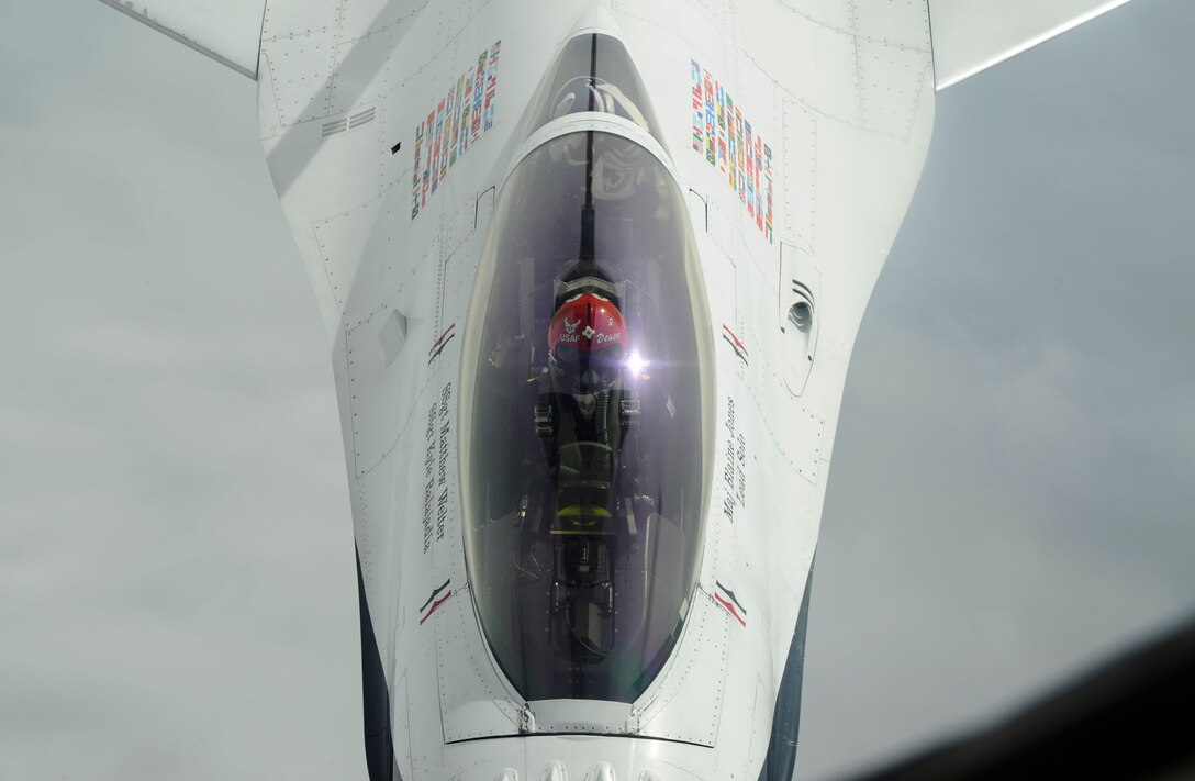 Maj. Blaine Jones positions his F-16C Fighting Falcon under a KC-135 Stratotanker during an aerial refueling Feb. 24, 2014. Jones and the other members of the Thunderbirds were returning from their first demonstration of the year at the Daytona 500 in Florida. Jones is the Thunderbirds lead solo. (U.S. Air Force photo/Airman 1st Class Victor J. Caputo)